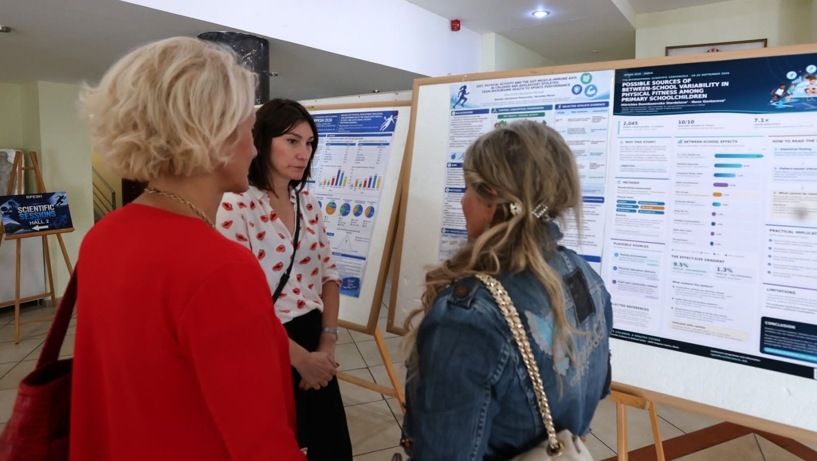 Participants exchanging ideas at a poster presentation